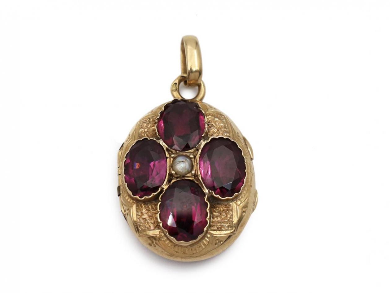 Antique French seed pearl and garnet oval locket in 18kt yellow gold