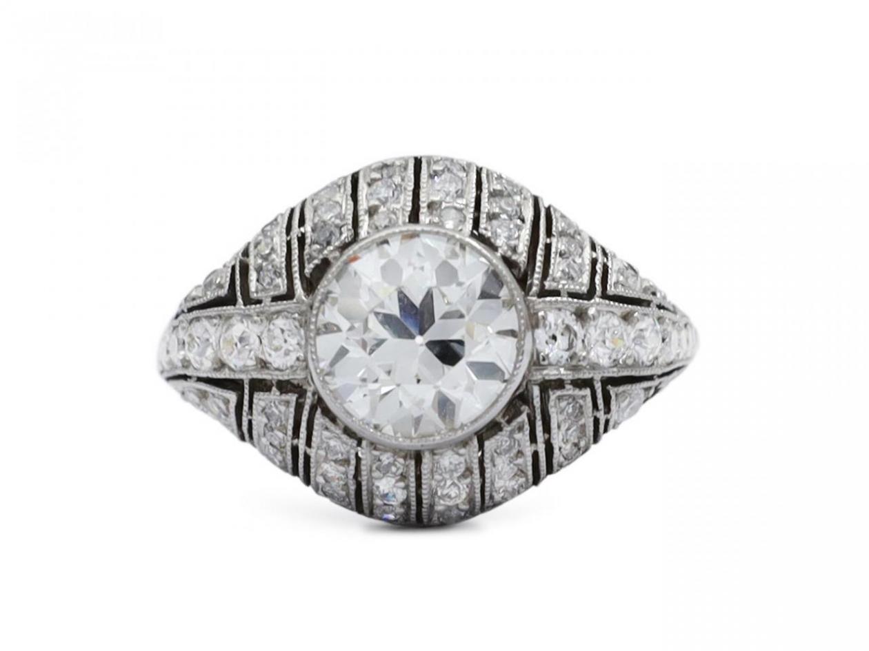 Art Deco diamond set bombe solitaire engagement ring in platinum