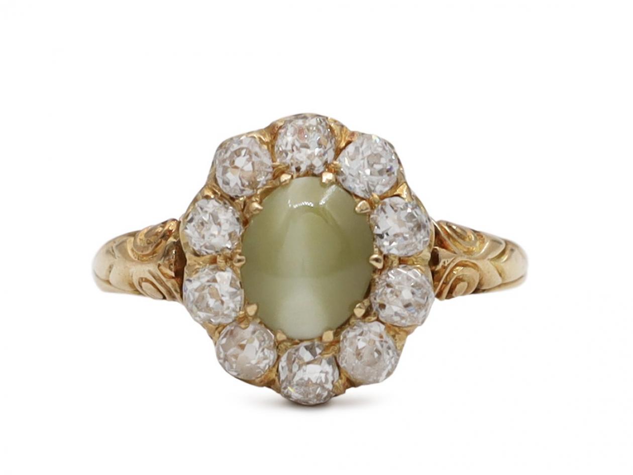 Antique cat's eye chrysoberyl and diamond oval cluster ring