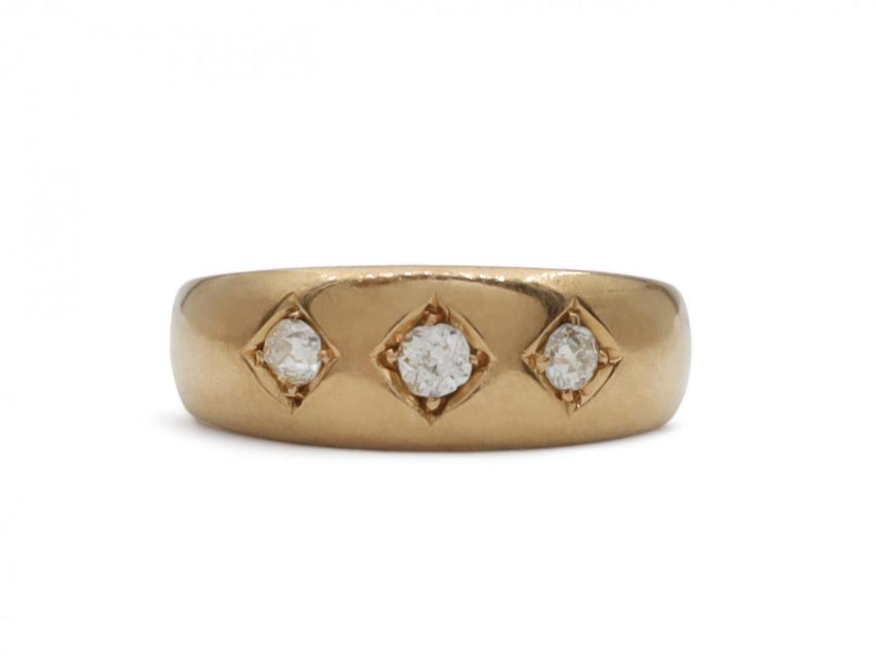 1894 diamond three stone gypsy ring in 18kt yellow gold