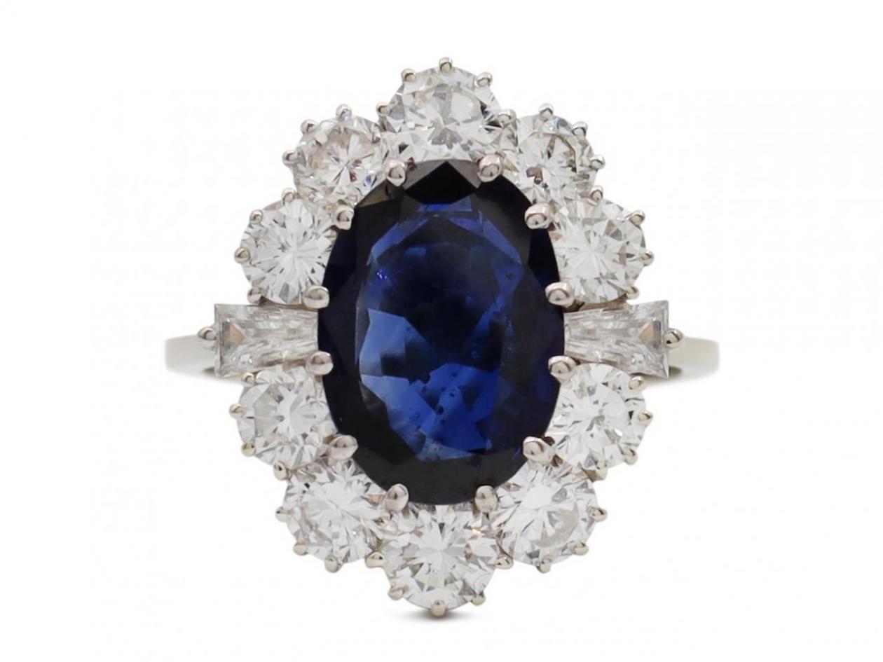 Vintage oval sapphire and diamond cluster engagement ring