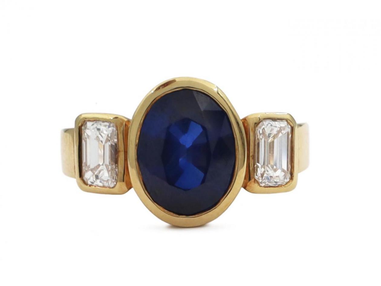 Modern sapphire and diamond three stone rubover ring